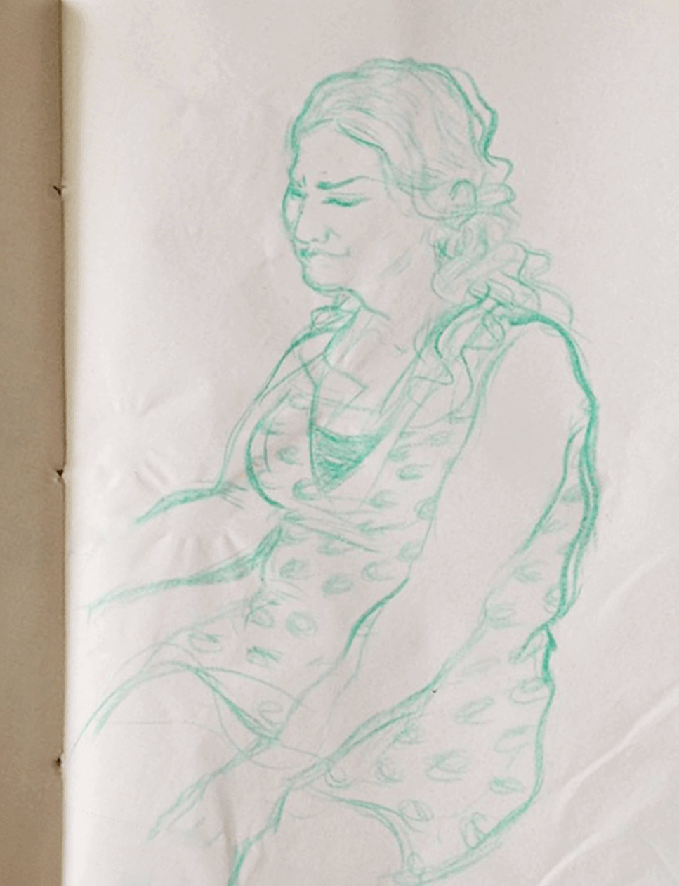 Observational drawing of a seated woman in a short, leopard-print dress by Roberto Millan & millantv.